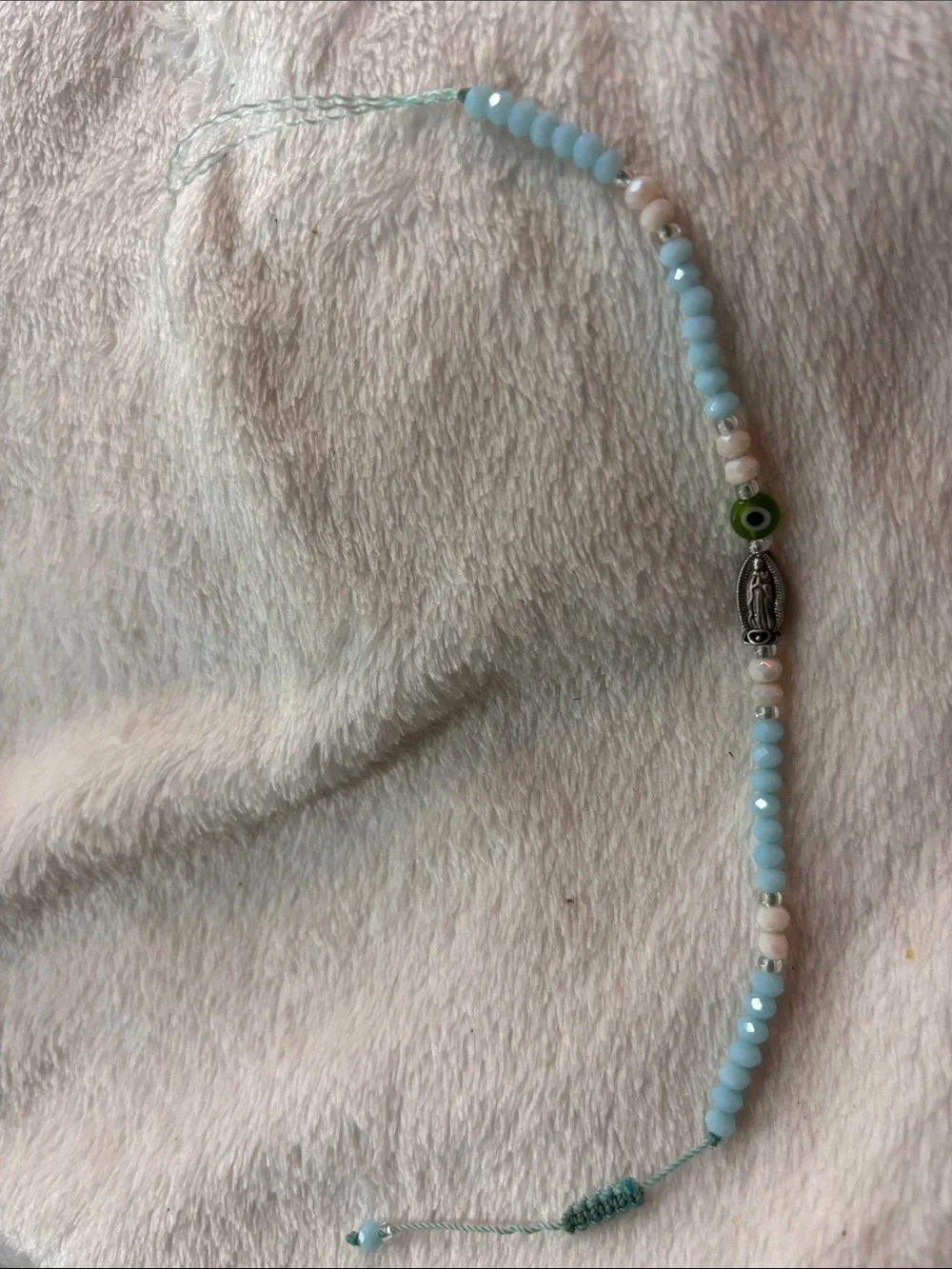 Light Blue Beaded Bracelet with Silver Charm and Green Accent